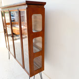 Mid Century Sculpted Curio with Glass Sides and Shelves