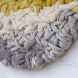 Round Woven Wall Hanging in Yellow + Grey on Driftwood